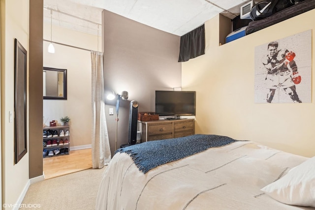 carpeted bedroom with baseboards and visible vents