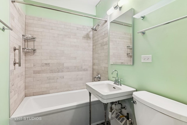 bathroom featuring toilet and shower / washtub combination