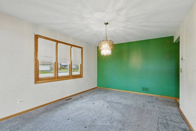633 Mendota Ln, Romeoville, IL 60446 - carpeted empty room featuring a chandelier, baseboards, and visible vents