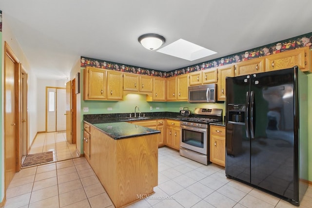 633 Mendota Ln, Romeoville, IL 60446 - kitchen with appliances with stainless steel finishes, a peninsula, dark countertops, a skylight, and a sink