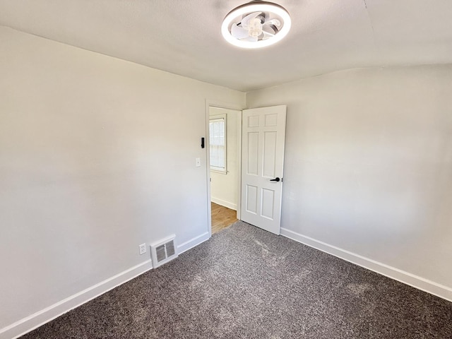 carpeted empty room with baseboards and visible vents