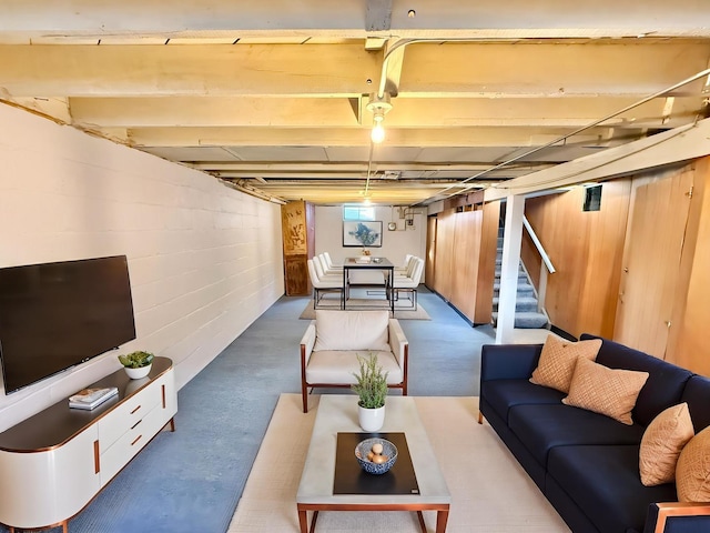 interior space with stairs and concrete block wall