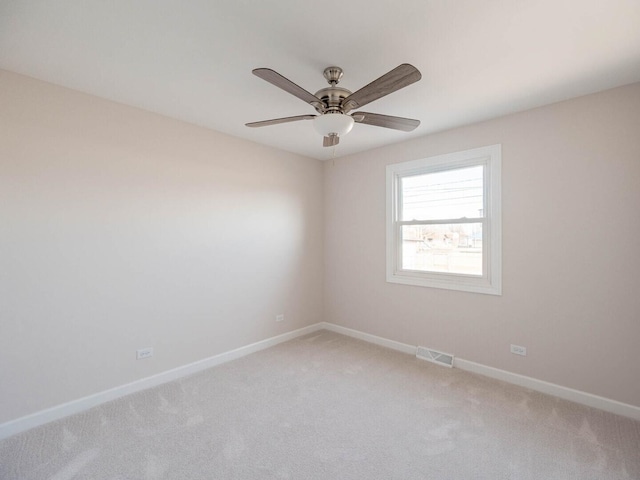 347 Madison Ave, Calumet City, IL 60409 - spare room with a ceiling fan, baseboards, light colored carpet, and visible vents