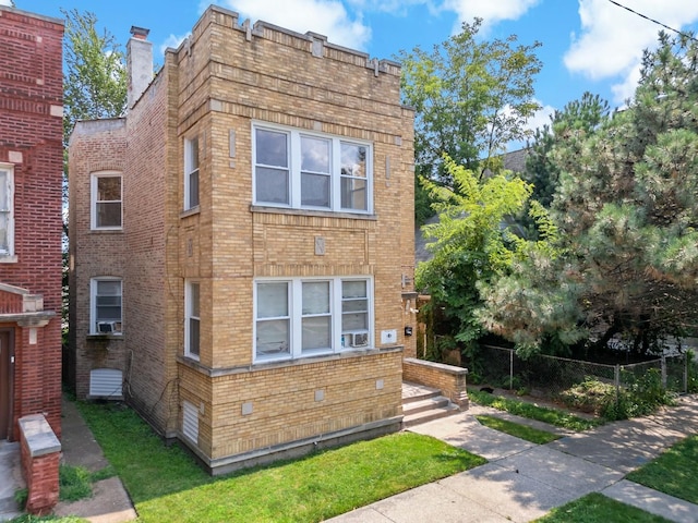 view of property exterior with fence, a chimney, cooling unit, and brick siding