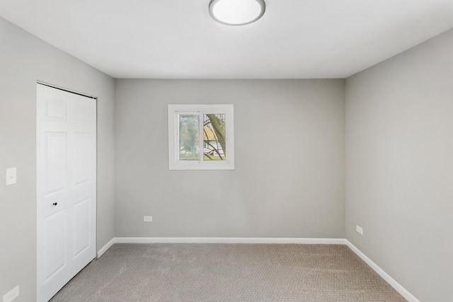753 Rogers Rd, Romeoville, IL 60446 - unfurnished bedroom featuring baseboards, carpet flooring, and a closet
