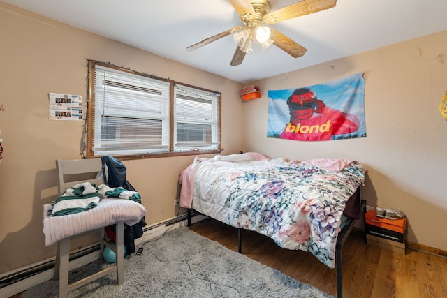 349 Yates Ave, Calumet City, IL 60409 - bedroom with baseboards, a ceiling fan, and wood finished floors