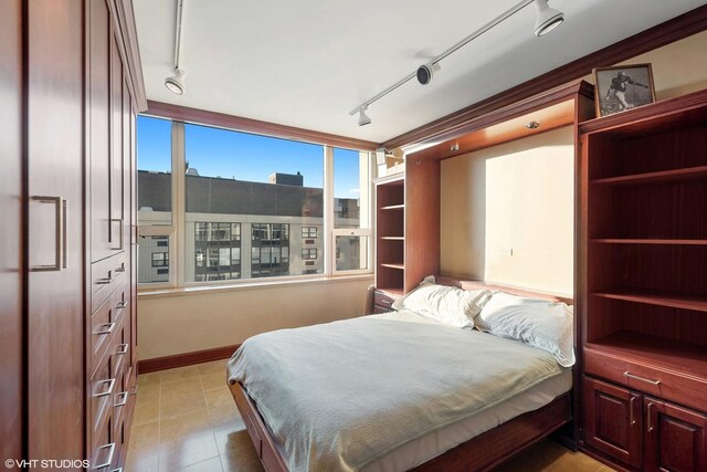1300 N Lake Shore Dr Unit 25B, Chicago, IL 60610 - bedroom with track lighting and baseboards