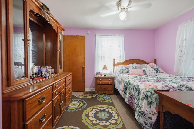 bedroom featuring a ceiling fan and baseboards