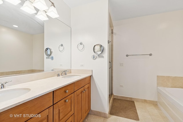 21 E Huron St Unit 1806, Chicago, IL 60611 - full bathroom with double vanity, a stall shower, a garden tub, baseboards, and tile patterned floors