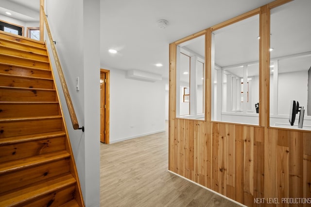 stairway featuring wood finished floors