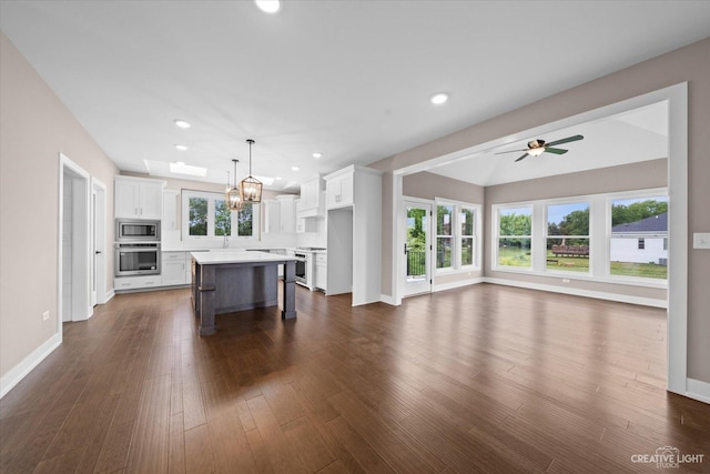 483 Deerfield Dr, Oswego, IL 60543 - unfurnished living room featuring baseboards, recessed lighting, and dark wood-style flooring