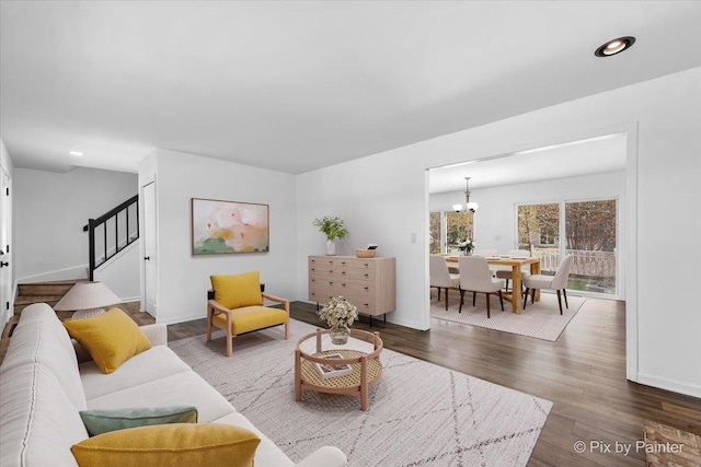 413 Edinburgh Ln, West Dundee, IL 60118 - living room featuring wood finished floors, baseboards, stairway, recessed lighting, and a notable chandelier
