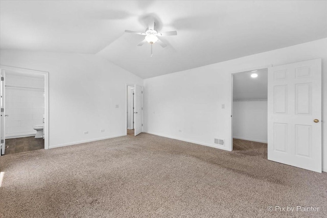413 Edinburgh Ln, West Dundee, IL 60118 - unfurnished bedroom with carpet floors, visible vents, lofted ceiling, ensuite bathroom, and a spacious closet