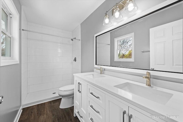 413 Edinburgh Ln, West Dundee, IL 60118 - bathroom with a sink, wood finished floors, toilet, and tiled shower