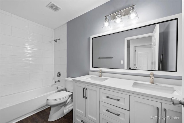 413 Edinburgh Ln, West Dundee, IL 60118 - bathroom with visible vents, a sink, wood finished floors, and toilet