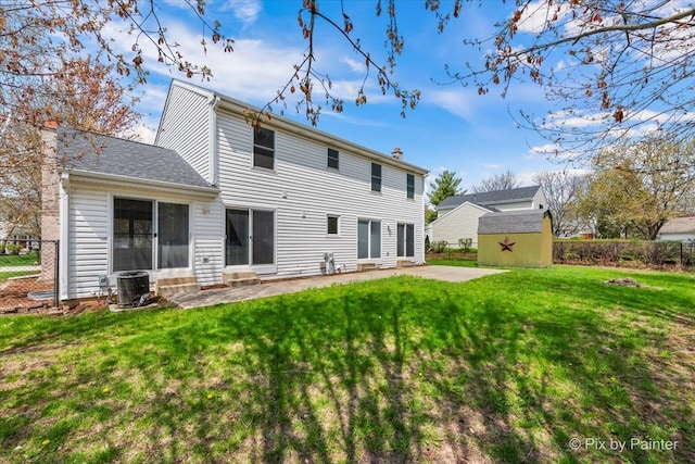 413 Edinburgh Ln, West Dundee, IL 60118 - back of property featuring central AC, fence, a storage unit, a patio, and entry steps