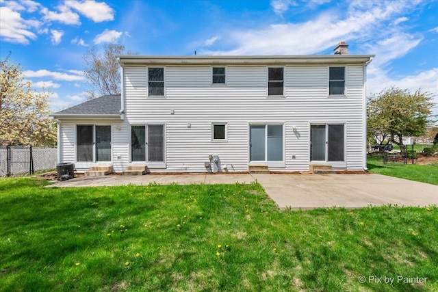 413 Edinburgh Ln, West Dundee, IL 60118 - rear view of house featuring a yard, fence, a chimney, and a patio area