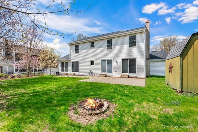 413 Edinburgh Ln, West Dundee, IL 60118 - back of property with a patio, a chimney, a yard, and an outdoor fire pit