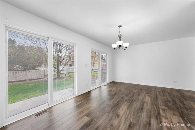 413 Edinburgh Ln, West Dundee, IL 60118 - unfurnished dining area with an inviting chandelier, dark wood-style flooring, and baseboards