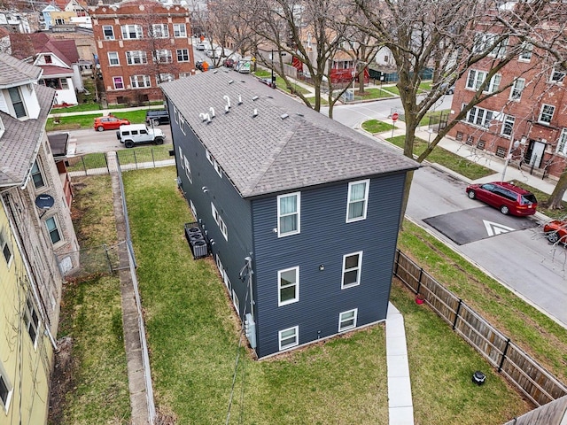 birds eye view of property with a residential view