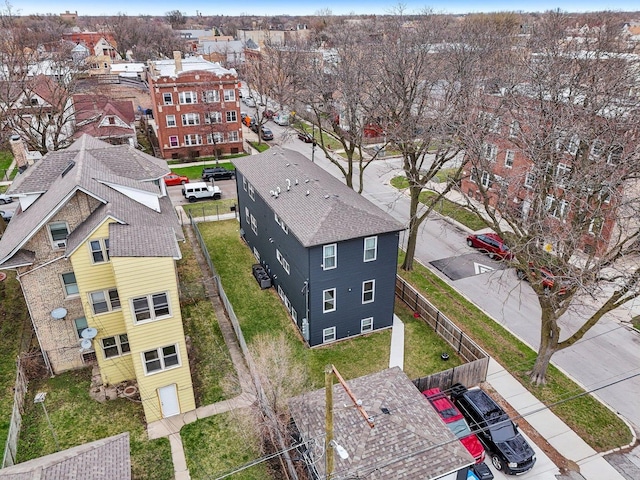 birds eye view of property with a residential view
