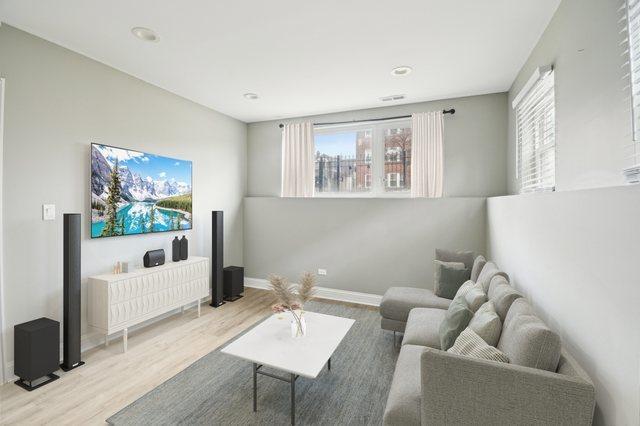 unfurnished room with visible vents, baseboards, and wood finished floors