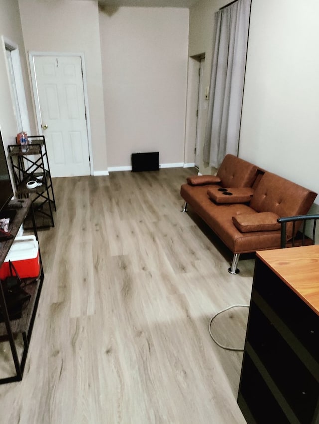3921 W Huron St Unit 3, Chicago, IL 60624 - living area featuring baseboards and wood finished floors