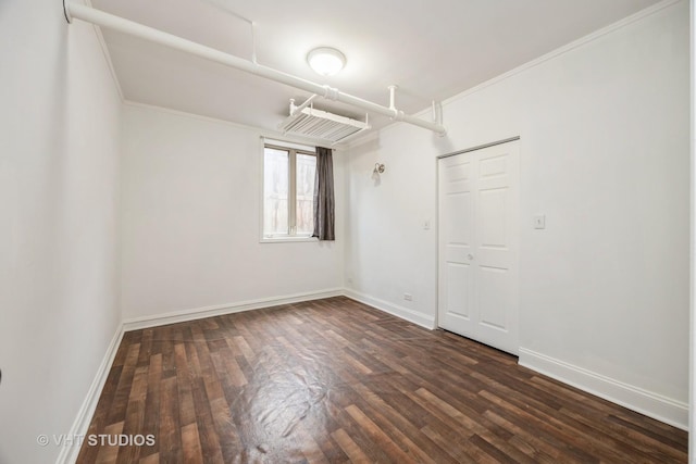 7001 W Altgeld St Unit G, Chicago, IL 60707 - empty room featuring dark wood finished floors, baseboards, and crown molding