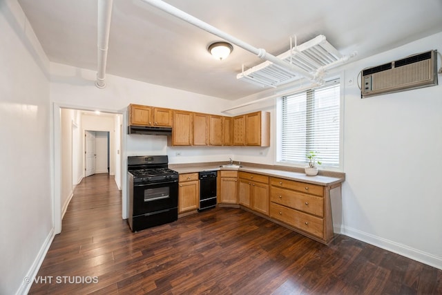 7001 W Altgeld St Unit G, Chicago, IL 60707 - kitchen featuring black gas range oven, light countertops, dark wood-style flooring, and under cabinet range hood