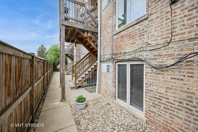 7001 W Altgeld St Unit G, Chicago, IL 60707 - view of patio featuring stairway and a wooden deck