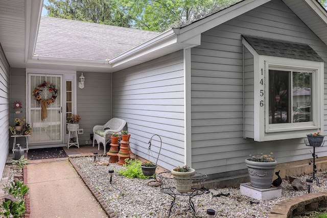 1456 Bangor Ln, Aurora, IL 60504 - view of exterior entry with a shingled roof