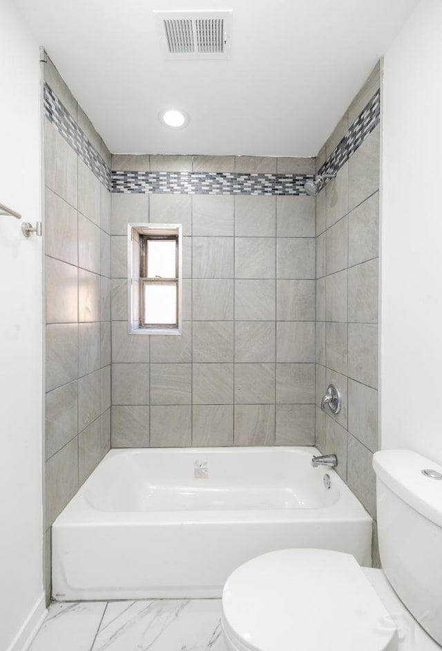 bathroom featuring marble finish floor, visible vents, toilet, and shower / bathing tub combination