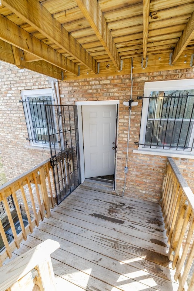 doorway to property with brick siding