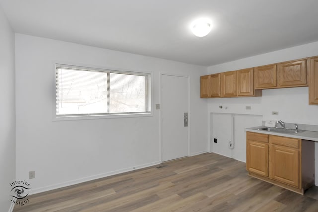 22426 Yates Ave, Sauk Village, IL 60411 - kitchen with light countertops, visible vents, baseboards, wood finished floors, and a sink