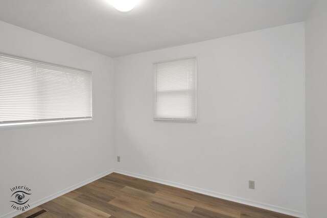22426 Yates Ave, Sauk Village, IL 60411 - unfurnished room with baseboards and wood finished floors