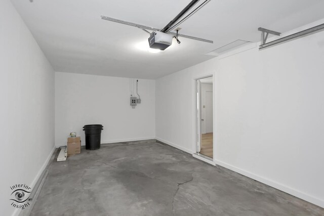 22426 Yates Ave, Sauk Village, IL 60411 - garage with baseboards and a garage door opener