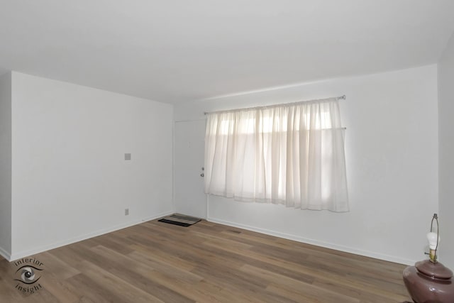 22426 Yates Ave, Sauk Village, IL 60411 - empty room with baseboards and wood finished floors