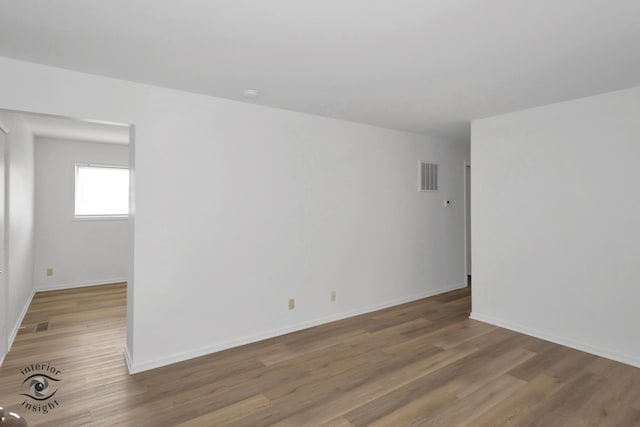 22426 Yates Ave, Sauk Village, IL 60411 - empty room with baseboards, visible vents, and wood finished floors