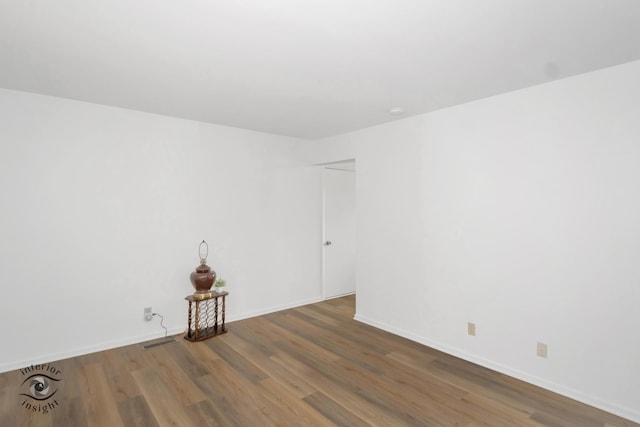 22426 Yates Ave, Sauk Village, IL 60411 - empty room featuring baseboards, visible vents, and wood finished floors