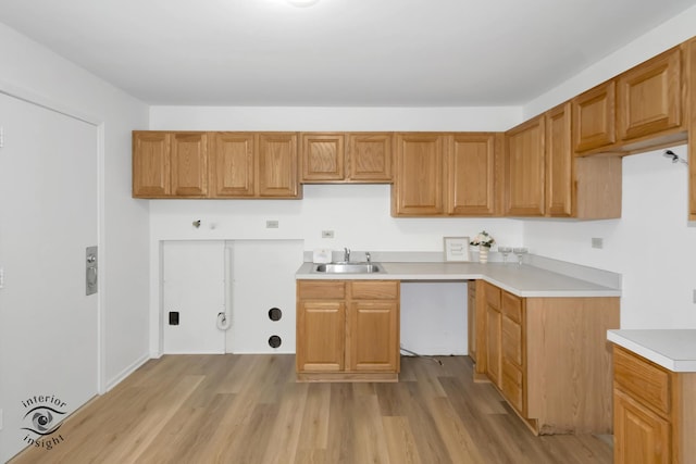 22426 Yates Ave, Sauk Village, IL 60411 - kitchen with dishwasher, light countertops, a sink, and light wood-style floors