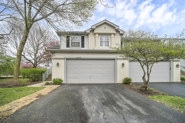 2470 Palazzo Ct, Buffalo Grove, IL 60089 - view of front of property with a garage, aphalt driveway, and stucco siding
