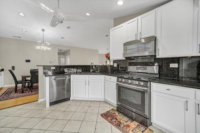 2470 Palazzo Ct, Buffalo Grove, IL 60089 - kitchen with visible vents, white cabinetry, a sink, ceiling fan with notable chandelier, and stainless steel appliances