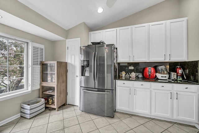 2470 Palazzo Ct, Buffalo Grove, IL 60089 - kitchen featuring decorative backsplash, lofted ceiling, dark countertops, white cabinets, and stainless steel fridge with ice dispenser