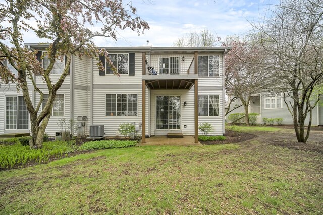 2470 Palazzo Ct, Buffalo Grove, IL 60089 - back of property with a yard, central AC, and a balcony