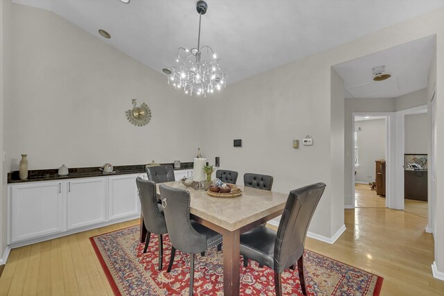 2470 Palazzo Ct, Buffalo Grove, IL 60089 - dining area featuring baseboards, light wood-type flooring, and a notable chandelier