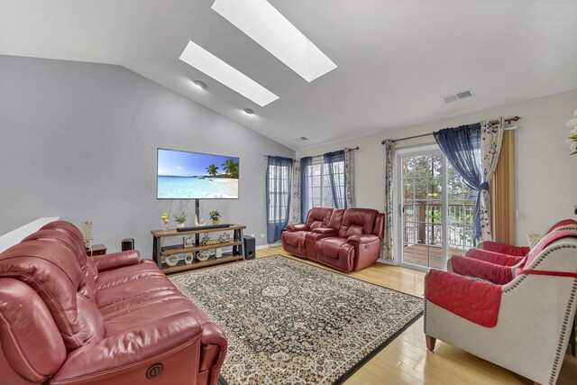 2470 Palazzo Ct, Buffalo Grove, IL 60089 - living area featuring a skylight, visible vents, light wood finished floors, and high vaulted ceiling