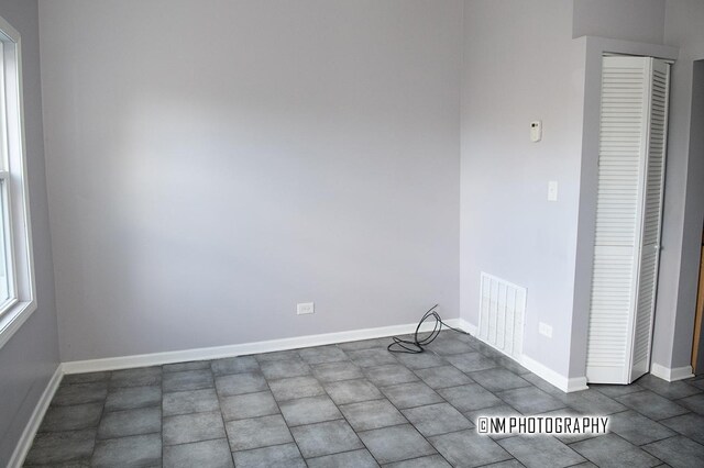 2152 W 19th St, Chicago, IL 60608 - unfurnished room featuring baseboards and visible vents