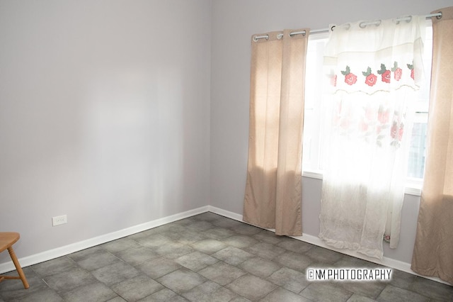 2152 W 19th St, Chicago, IL 60608 - spare room with baseboards and a healthy amount of sunlight