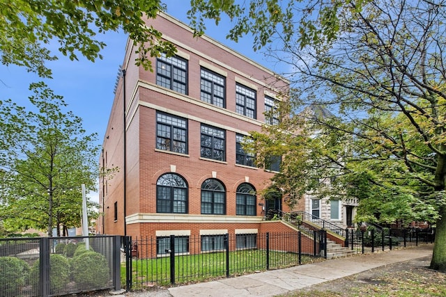 5486 S Woodlawn Ave Unit 3, Chicago, IL 60615 - view of property featuring a fenced front yard