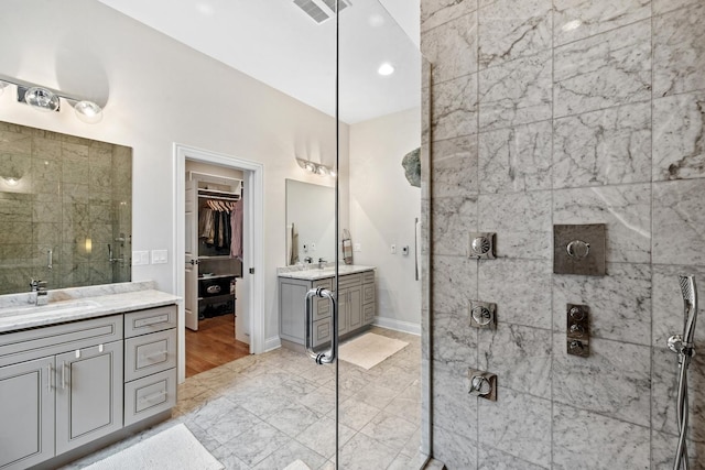 5486 S Woodlawn Ave Unit 3, Chicago, IL 60615 - bathroom with a stall shower, a sink, two vanities, a spacious closet, and visible vents